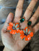 Enamel flower earrings , orange flower earrings ,long orange earrings , orange and green earrings